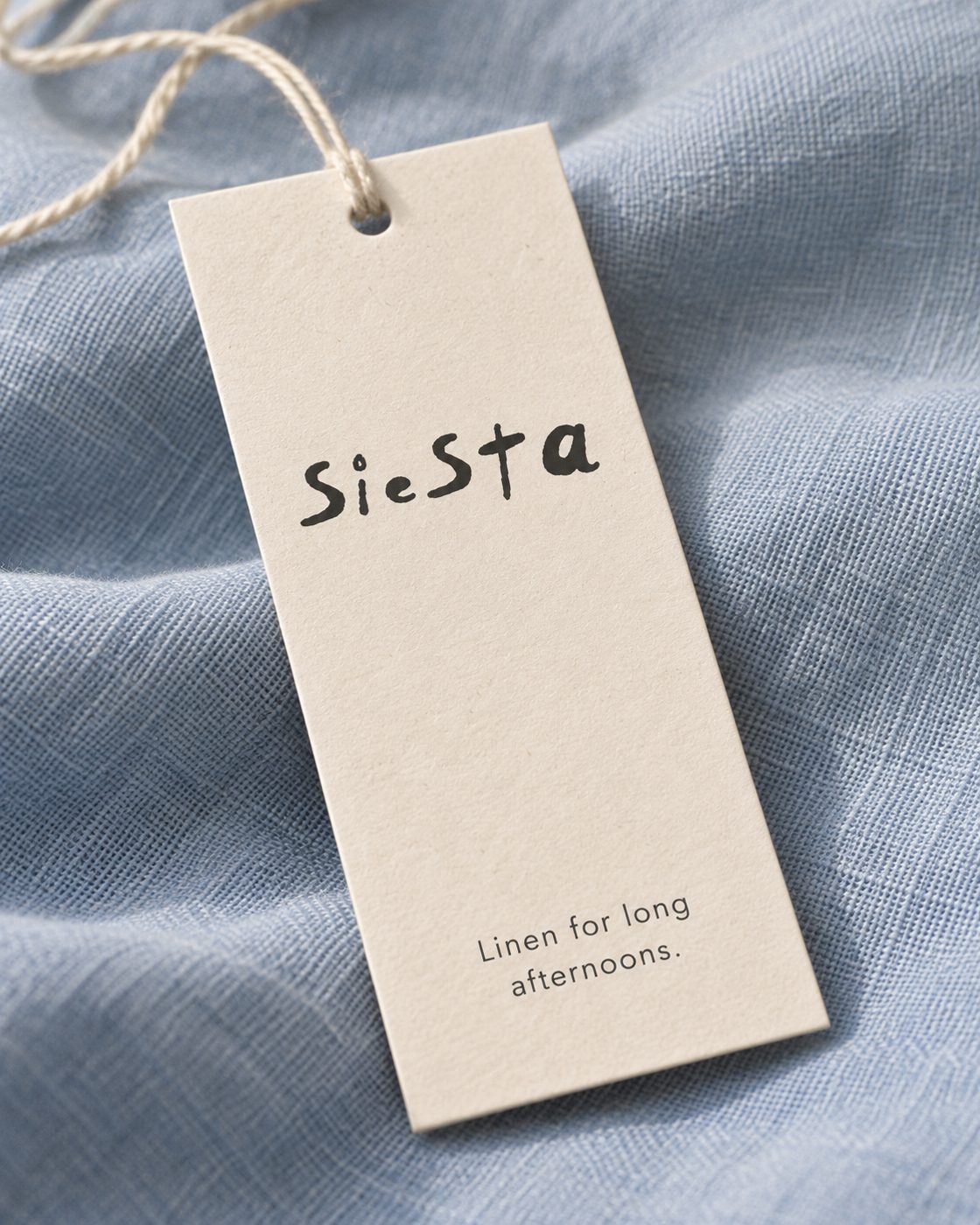 Siesta swing tag: Linen for long afternoons