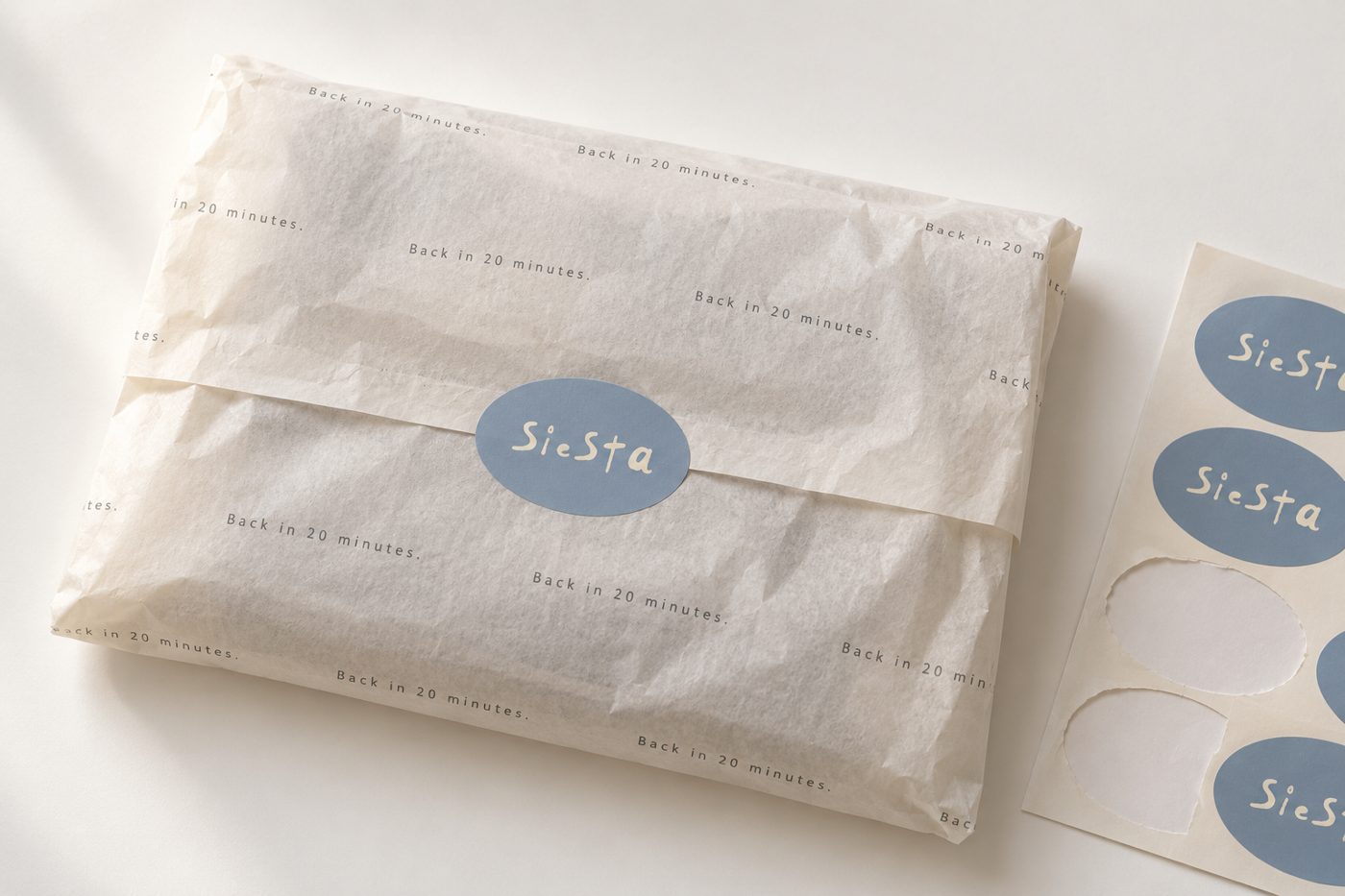 Parcel wrapped in Back in 20 minutes tissue with Siesta sticker